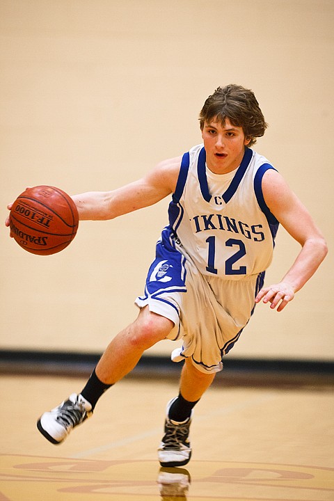 SHAWN GUST/Press

Coeur d'Alene High School's Joe Roletto drives down the court in the consolation game against Borah High.