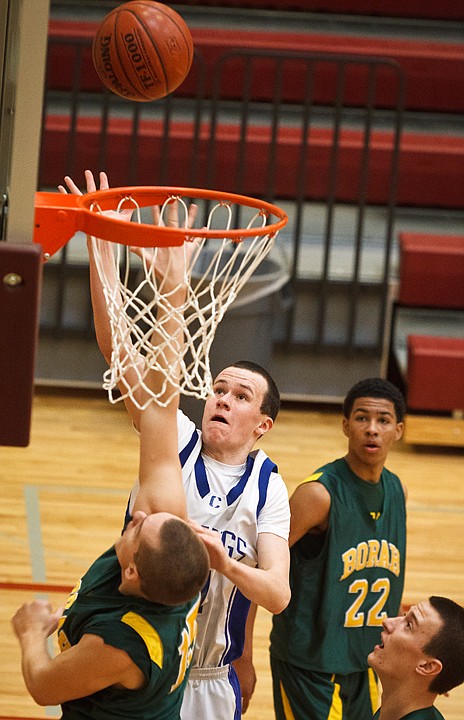 SHAWN GUST/Press

The Vikings' Ty Higbie follows his shot as he scores against Borah defenders.