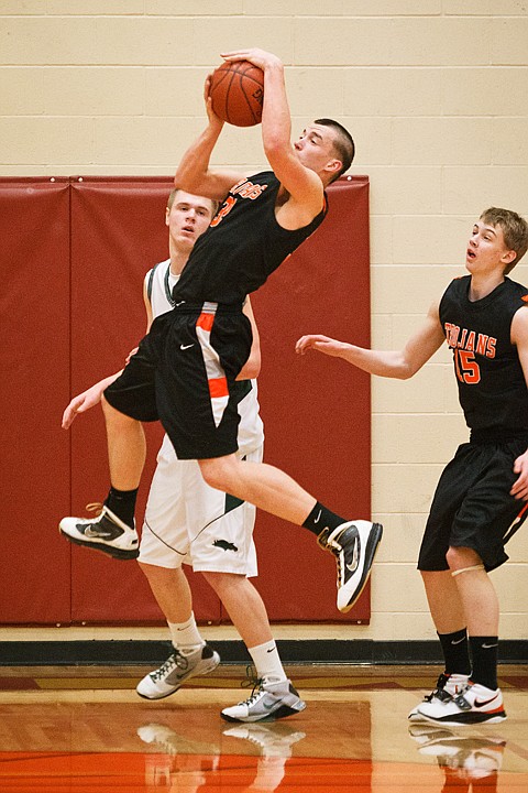 SHAWN GUST/Press

Matt Lickfold, of Post Falls,  leaps into the air for a rebound Saturday during the first quarter against Eagle High School in Nampa.