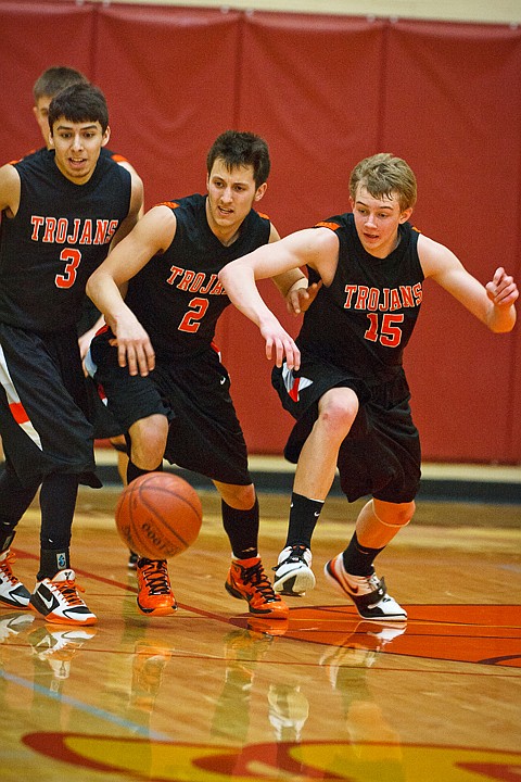 SHAWN GUST/Press

From left, Damon Gonzalez, Kyle English and Luke Thoreson scramble to take possession of a loose ball in the second half.