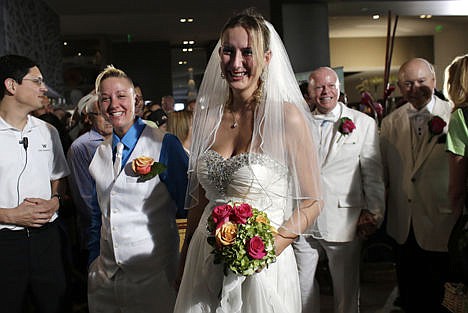 &lt;p&gt;Jessica Dunnam, left, and Charlene Emm, right, arrive with other couples for a group wedding ceremony at a hotel in honor of Florida's ruling in favor of same-sex marriage equality Feb. 5, in Fort Lauderdale, Fla. In January, Florida became the 36th state where gay marriage is legal.&lt;/p&gt;