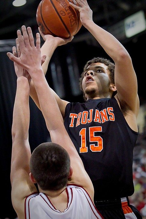&lt;p&gt;Post Falls High's Malcolm Colbert puts up a shot in front of a Madison High defender during Friday's game at the state 5A boys basketball tournament at the Idaho Center in Nampa.&lt;/p&gt;