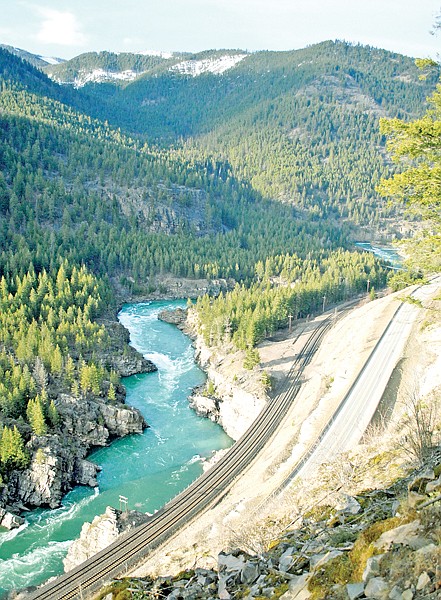 The Kootenai River, U.S. Highway 2 and the railroad tracks weave their way through the mountains west of Libby. The view is from the old Highway 2 trail.