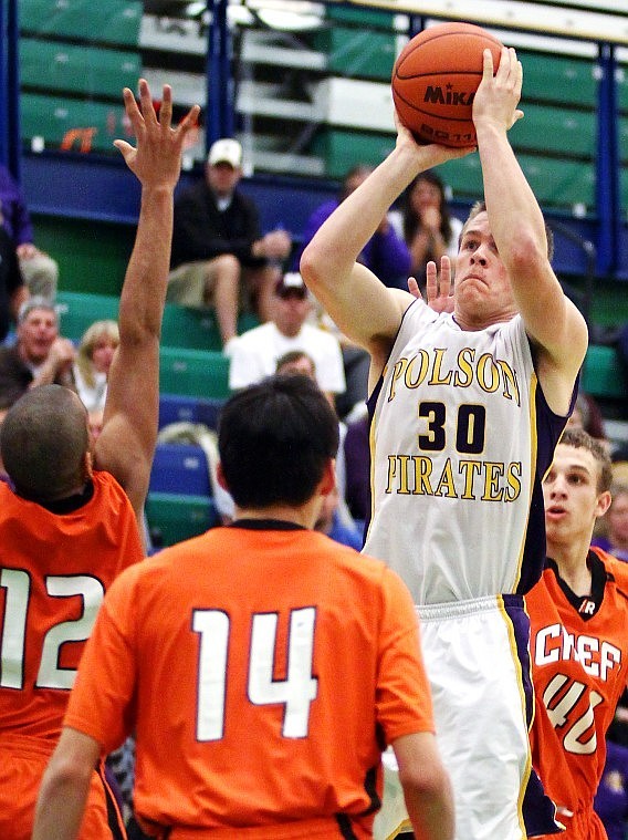 Polson&#146;s Tim Rausch lifts a shot over Ronan&#146;s Marcus Hungerford (12) during the Northwestern A divisional challenge game at Glacier High School Monday evening. Polson won the game to secure a trip to this week&#146;s Class A state tournament in Butte.