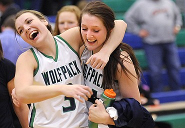 <p>Taylor Salonen, left, and Katie Wiley embrace as they walk off the court after beating Missoula Hellgate 57-30 to earn a berth in the AA state playoffs. (Aaric Bryan/Daily Inter Lake)</p>