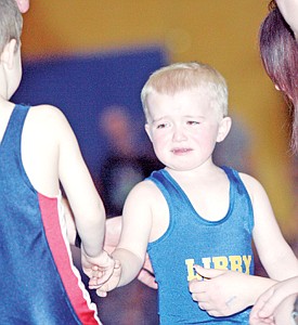 &lt;p&gt;A tearful Bransen Holzer shakes hands with his opponent Saturday at the Kootenai Klassic Little Guy Wrestling Tourney.&lt;/p&gt;