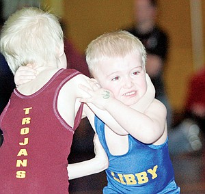 &lt;p&gt;Peewee wrestler Bransen Holzer 3-1/2, mixes it up with Troy's Lukas Fritts, 4, during Saturday's Kootenai Klassic Little Guy Wrestling Tourney.&lt;/p&gt;