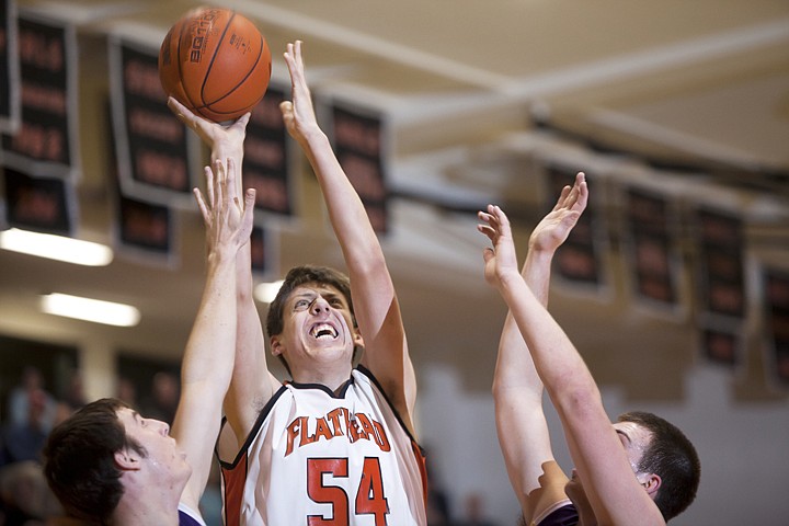 &lt;p&gt;FLATHEAD POST Garth West (54) puts up a shot between two Missoula Sentinel defenders during Flathead&#146;s victory Thursday night at Flathead High School.&lt;/p&gt;