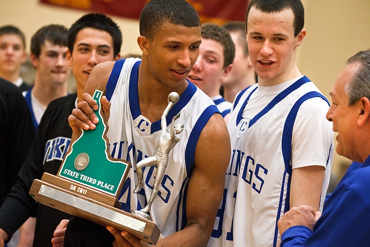 &lt;p&gt;Coeur d'Alene's Deon Watson shares the State 5A third place trophy with his team and coaches Saturday after beating Borah High School 69-51.&lt;/p&gt;