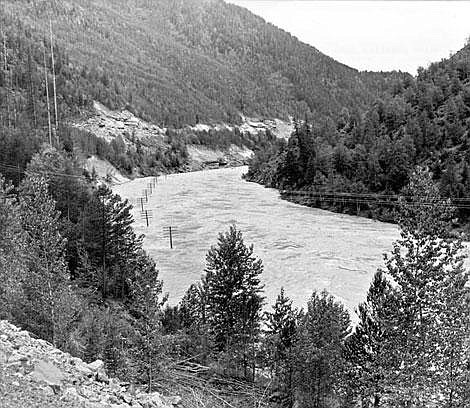 The flood-swollen Middle Fork of the Flathead River is shown during the massive flood of June 1964. The flood washed out or damaged five bridges; six miles of railroad track and 20 miles of highway were washed away. Mel Ruder photo/Hungry Horse News