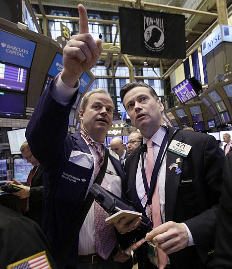 &lt;p&gt;FILE - In this March 2, 2012 file photo, traders David O'Day, left, and Neil Catania confer on the floor of the New York Stock Exchange. Worries over China's economic growth and whether Greece can entice enough private creditors to participate in a bond swap deal weighed on markets Monday, March 5, 2012, at the start of a busy week which culminates with closely-watched U.S. jobs figures. (AP Photo/Richard Drew, File)&lt;/p&gt;