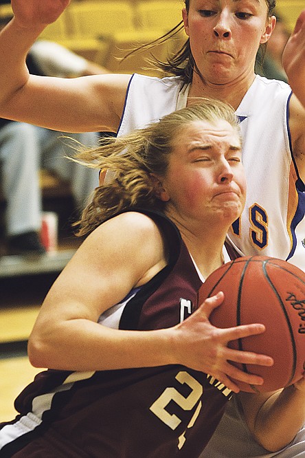 &lt;p&gt;Amy Warbrick, of North Idaho College, makes contact with Salt Lake Community College's Marissa Robbins during Region 18 women's basketball action.&lt;/p&gt;