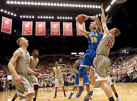 &lt;p&gt;UCLA's Reeves Nelson (22) shoots while defended by Washington State's Brock Motum (12) during overtime Saturday at Pullman.&lt;/p&gt;