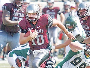 <p>FILE - In this Sept. 10, 2011 file photo, Montana quarterback Jordan Johnson (10) scrambles against Cal Poly during an NCAA college football game in Missoula, Mont. Jury selection in the trial for Johnson, charged in the rape of a friend while the two were watching a movie at her apartment, is scheduled to begin Friday, Feb. 8, 2013. (AP Photo/Michael Albans, File)</p>