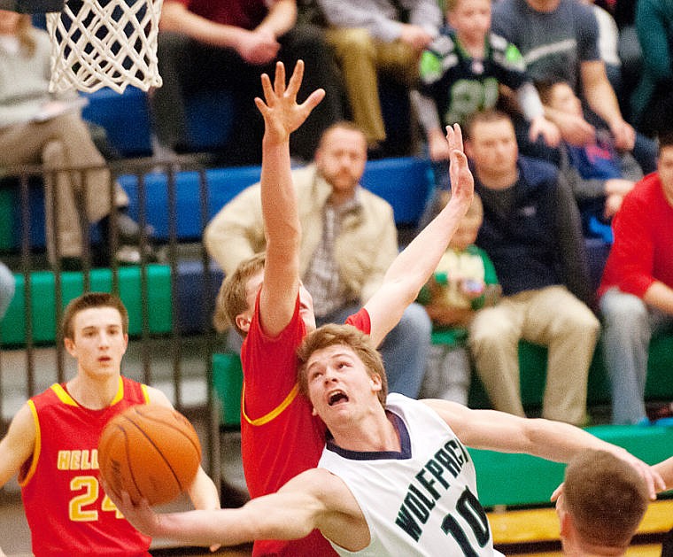 &lt;p&gt;Glacier senior guard Evan Epperly (10) is fouled as he puts up a shot Tuesday night during Glacier's loss at home to Missoula Hellgate. Feb. 25, 2014 in Kalispell, Montana. (Patrick Cote/Daily Inter Lake)&lt;/p&gt;