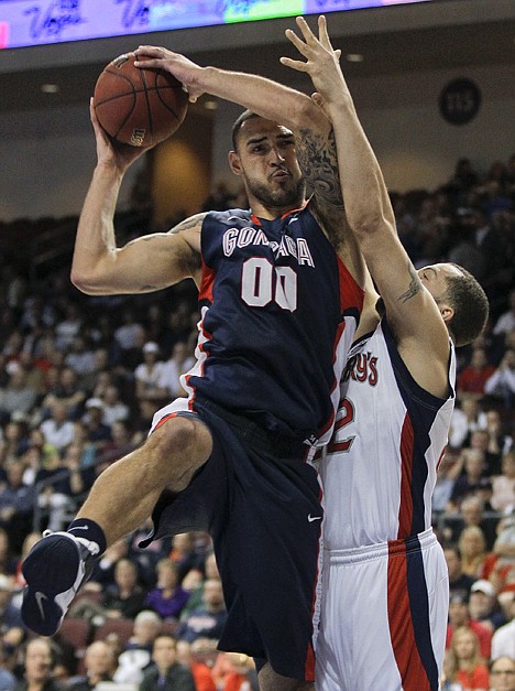 &lt;p&gt;Gonzaga's Robert Sacre, left, grabs a rebound against Saint Mary's Rob Jones in the first half during an NCAA college basketball game for the West Coast Conference men's tournament title Monday, March 5, 2012, in Las Vegas. (AP Photo/Julie Jacobson)&lt;/p&gt;