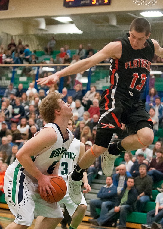 &lt;p&gt;Glacier senior guard Evan Epperly (10) ducks under Flathead senior Blaine Newman (13) on a breakaway Friday night during the second half of Glacier's victory over Flathead at Glacier High School. March 7, 2014 in Kalispell, Montana. (Patrick Cote/Daily Inter Lake)&lt;/p&gt;