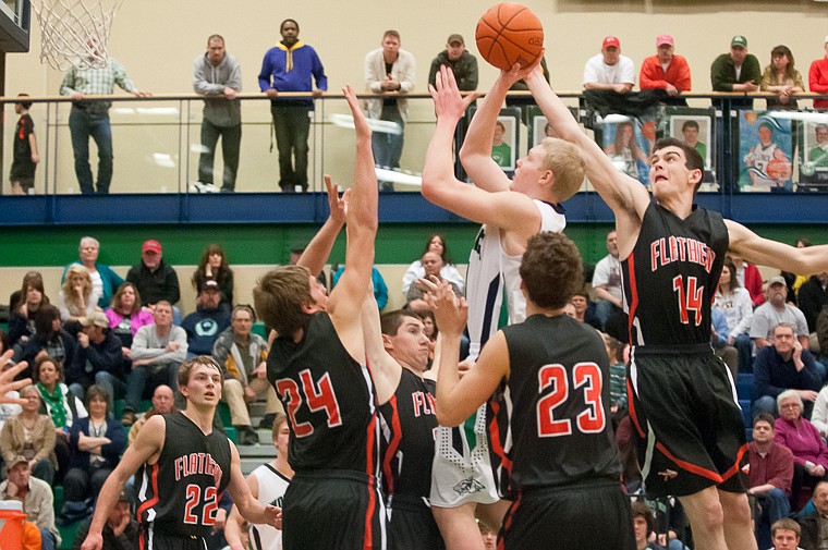 &lt;p&gt;Glacier senior wing Bryan Michaels (11) puts up a shot Friday night during the second half of Glacier's victory over Flathead at Glacier High School. March 7, 2014 in Kalispell, Montana. (Patrick Cote/Daily Inter Lake)&lt;/p&gt;