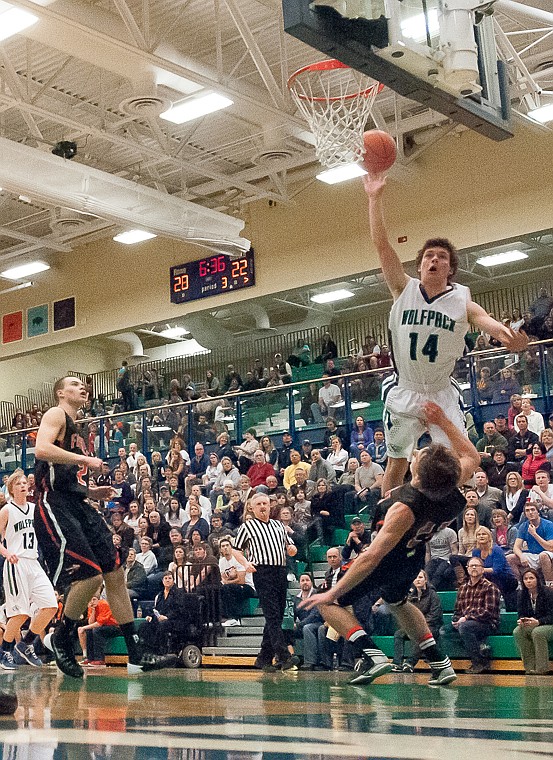 &lt;p&gt;Glacier senior guard Tanner Olsen (14) puts up a shot Friday night during the second half of Glacier's victory over Flathead at Glacier High School. March 7, 2014 in Kalispell, Montana. (Patrick Cote/Daily Inter Lake)&lt;/p&gt;