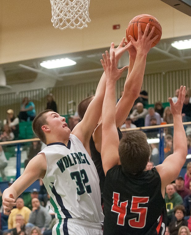 &lt;p&gt;Glacier freshman wing Jaxen Hashley (32) and Flathead senior Adam Bradley (45) go after a rebound Friday night during the second half of Glacier's victory over Flathead at Glacier High School. March 7, 2014 in Kalispell, Montana. (Patrick Cote/Daily Inter Lake)&lt;/p&gt;