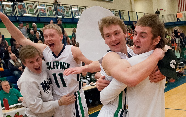 &lt;p&gt;Glacier senior wing Bryan Michaels (11) and senior guard Evan Epperly (10) celebrate with fans Friday night after Glacier's victory over Flathead at Glacier High School. March 7, 2014 in Kalispell, Montana. (Patrick Cote/Daily Inter Lake)&lt;/p&gt;