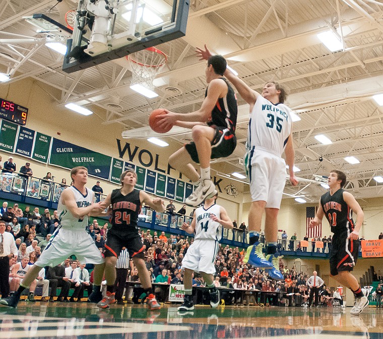 &lt;p&gt;Flathead senior Matt Quist (52) goes up for a shot Friday night during the first half of Glacier's victory over Flathead at Glacier High School. March 7, 2014 in Kalispell, Montana. (Patrick Cote/Daily Inter Lake)&lt;/p&gt;