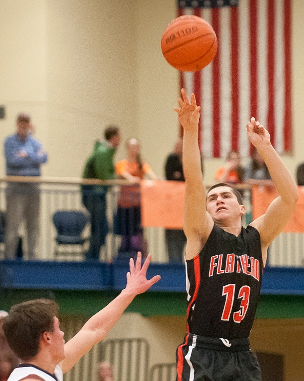 &lt;p&gt;Flathead senior Blaine Newman (13) shoots the ball Friday night during the first half of Glacier's victory over Flathead at Glacier High School. March 7, 2014 in Kalispell, Montana. (Patrick Cote/Daily Inter Lake)&lt;/p&gt;