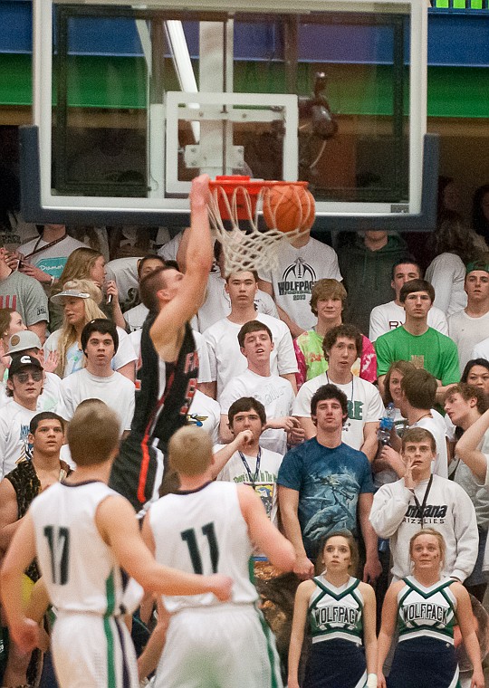 &lt;p&gt;Flathead senior Matt Quist (52) goes up for an alley-oop dunk Friday night during the first half of Glacier's victory over Flathead at Glacier High School. March 7, 2014 in Kalispell, Montana. (Patrick Cote/Daily Inter Lake)&lt;/p&gt;