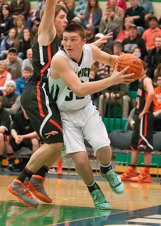 &lt;p&gt;Glacier freshman wing Jaxen Hashley (32) drives along the baseline Friday night during the first half of Glacier's victory over Flathead at Glacier High School. March 7, 2014 in Kalispell, Montana. (Patrick Cote/Daily Inter Lake)&lt;/p&gt;