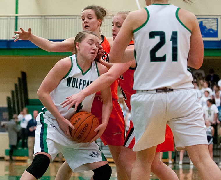 &lt;p&gt;Glacier sophomore guard Hailee Bennett (4) drives through defenders Friday night during the first of half of Glacier's matchup against Flathead at Glacier High School. March 7, 2014 in Kalispell, Montana. (Patrick Cote/Daily Inter Lake)&lt;/p&gt;