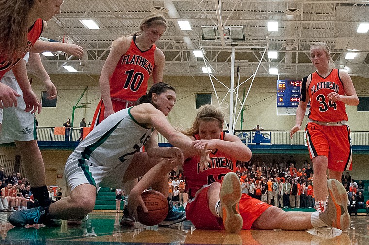 &lt;p&gt;Flathead senior Jenessa Heine (43) and Glacier senior center Cassi Hashley (21) fight for a loose ball Friday night during the second of half of Glacier's victory over Flathead at Glacier High School. March 7, 2014 in Kalispell, Montana. (Patrick Cote/Daily Inter Lake)&lt;/p&gt;