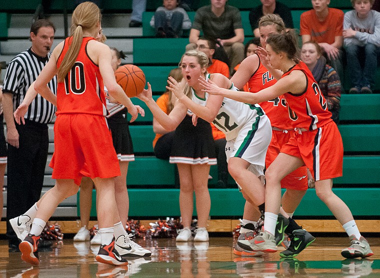 &lt;p&gt;Glacier senior forward Hannah Atlee (12)} passes the ball Friday night during the first of half of Glacier's matchup against Flathead at Glacier High School. March 7, 2014 in Kalispell, Montana. (Patrick Cote/Daily Inter Lake)&lt;/p&gt;