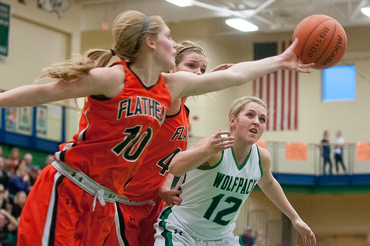 &lt;p&gt;Glacier senior forward Hannah Atlee (12), Flathead senior Jenessa Heine (43) and Flathead senior Emma Andrews (10) go after a rebound Friday night during the first of half of Glacier's matchup against Flathead at Glacier High School. March 7, 2014 in Kalispell, Montana. (Patrick Cote/Daily Inter Lake)&lt;/p&gt;