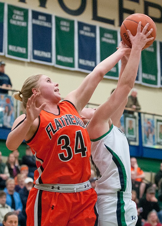 &lt;p&gt;Flathead junior Jessica Simmons (34) stretches for a rebound Friday night during the first of half of Glacier's matchup against Flathead at Glacier High School. March 7, 2014 in Kalispell, Montana. (Patrick Cote/Daily Inter Lake)&lt;/p&gt;