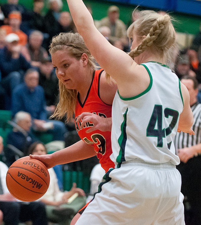 &lt;p&gt;Flathead senior Jenessa Heine (43) drives around Glacier sophomore forward Ali Williams (42) Friday night during the first of half of Glacier's matchup against Flathead at Glacier High School. March 7, 2014 in Kalispell, Montana. (Patrick Cote/Daily Inter Lake)&lt;/p&gt;