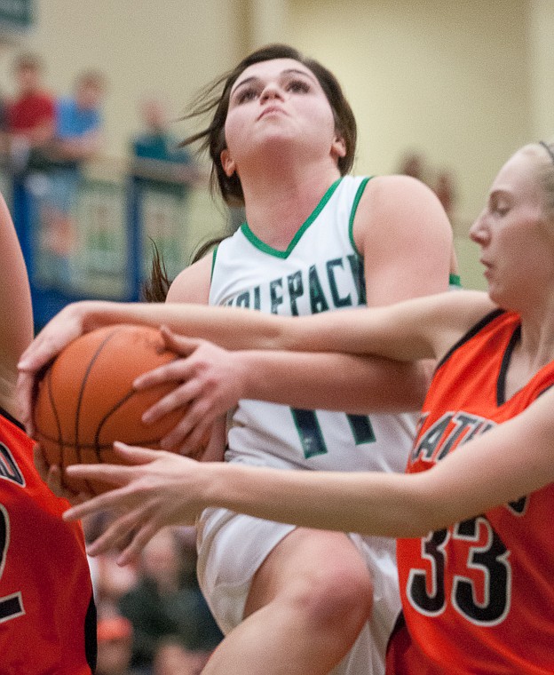 &lt;p&gt;Glacier junior guard Taylor Loomis (11) is fouled while going up for a shot Friday night during the second of half of Glacier's victory over Flathead at Glacier High School. March 7, 2014 in Kalispell, Montana. (Patrick Cote/Daily Inter Lake)&lt;/p&gt;