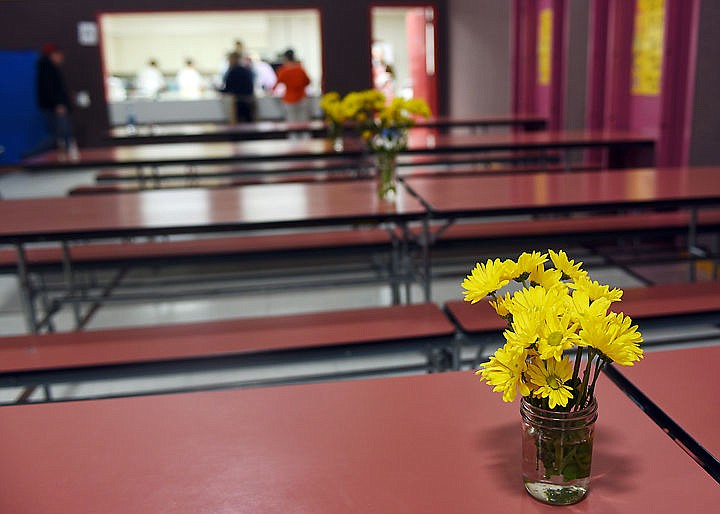 &lt;p&gt;Fresh cut flowers add a touch of color to the tables prepared for the once-a-month community dinner at the Canyon Elementary School on Thursday, February 26, in Hungry Horse. (Brenda Ahearn/Daily Inter Lake)&lt;/p&gt;
