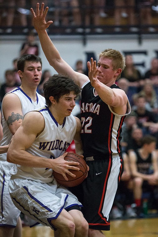 &lt;p&gt;Tucker Gust works around Parma players after catching a rebound.&lt;/p&gt;