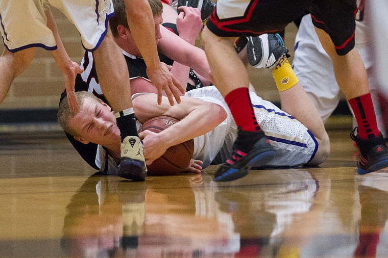 &lt;p&gt;Kellog&#146;s Caleb McDonald holds on to a loose ball as a Parma player attempts to take it&lt;/p&gt;