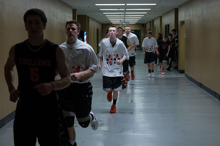 &lt;p&gt;Post Falls basketball players jog down a corridor in the Idaho center on their way into the arena.&lt;/p&gt;