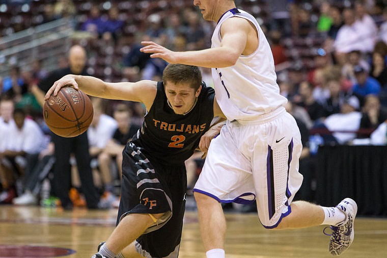 &lt;p&gt;Nick Hall, a Post Falls guard, makes contact with a Rocky Mountain player as he drives the ball toward the hoop.&lt;/p&gt;