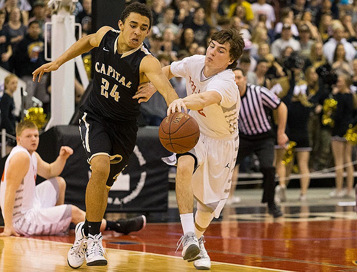 &lt;p&gt;Capital High&#146;s Cameron Godeny-Scott and Post Falls Dalton Thompson go for a loose ball in the third quarter.&lt;/p&gt;