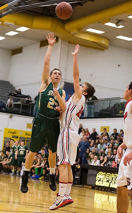 &lt;p&gt;St. Maries&#146; Bryant Asbury shoots a jump shot over Soda Springs defender Landry Schvaneveldt in the first period.&lt;/p&gt;