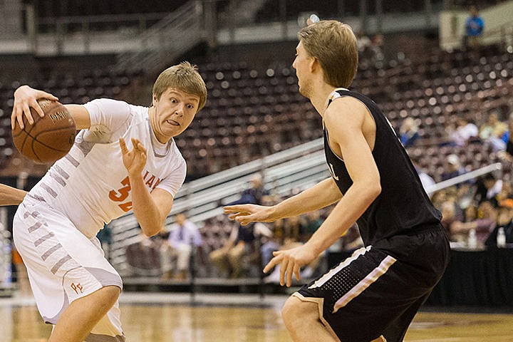 &lt;p&gt;Post Falls High School post Jack Millsap jukes a Capital defender during the first half.&lt;/p&gt;