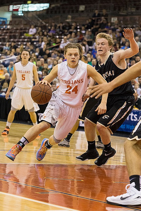 &lt;p&gt;The Trojans&#146; Zach Hillman drives to the hoop against Capital in the semi-final round on Friday.&lt;/p&gt;