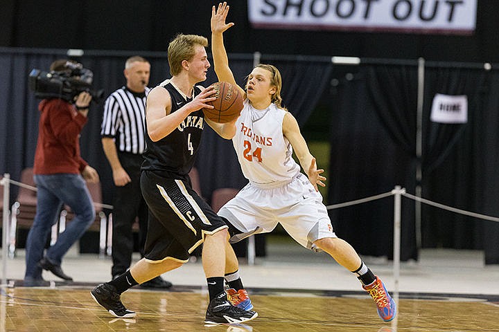 &lt;p&gt;Post Falls&#146; Zach Hillman plays defense against Capital defender Justin Saunders during the first quarter in Nampa.&lt;/p&gt;