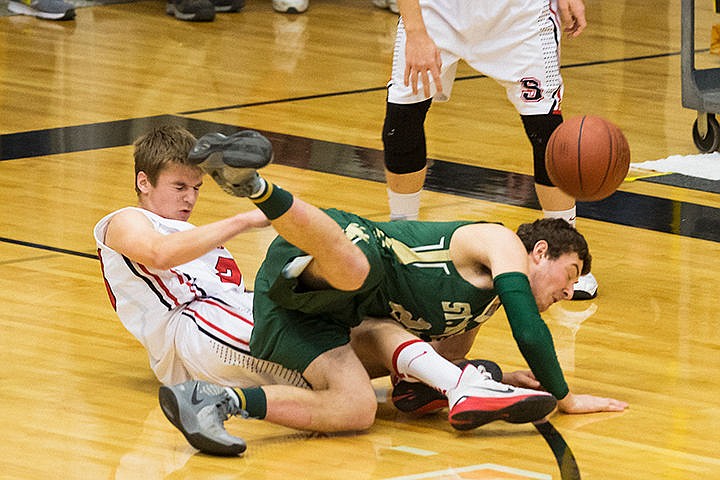 &lt;p&gt;St. Maries High School forward Jacob Greer falls to the floor after colliding with Soda Springs&#146; Landry Schvaneveldt while chasing a loose ball in the first half of the semi-final round of the state 2A boys basketball tournament Friday at Capital High School in Boise.&lt;/p&gt;