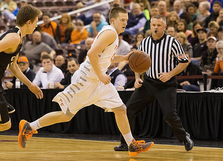 &lt;p&gt;Post Falls&#146; Ryan English dribbles up the court during the first half at the Idaho Center.&lt;/p&gt;