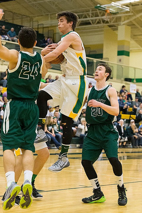 &lt;p&gt;The Hawks&#146; Auston Henry secures a rebound before Burley defenders could get to the ball. To order prints go to http://cdapress.com/photojournalism.&lt;/p&gt;