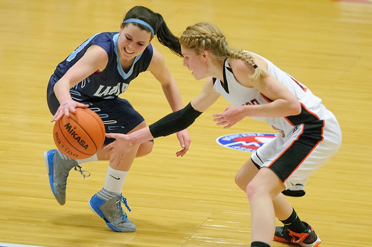 &lt;p&gt;Flathead junior Emma Andrews (10) tips the ball away from Great Falls' Taylor Kumm (30) Thursday night during Flathead's matchup against Great Falls High in the first round of the Class AA State Championship in Great Falls. Thursday, March 7, 2013 in Great Falls, Montana. (Patrick Cote/Daily Inter Lake)&lt;/p&gt;